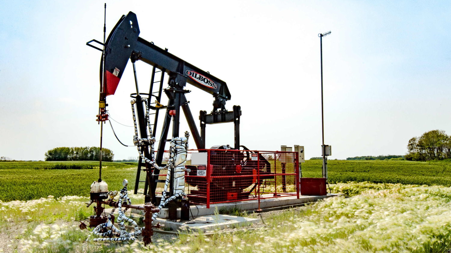 IJACK DGAS beam-mounted casing gas compressor on conventional, traditional pumpjack oil well